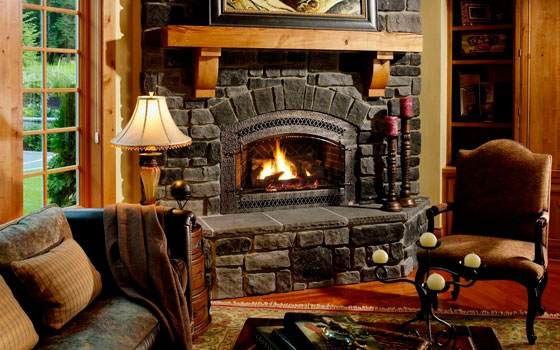 antient-style-corner-fireplace-stone-facing-with-sconces-and-candles